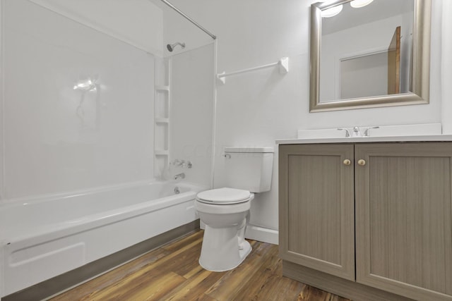 full bathroom with toilet, vanity, wood-type flooring, and tub / shower combination