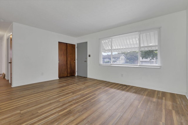 empty room featuring hardwood / wood-style floors