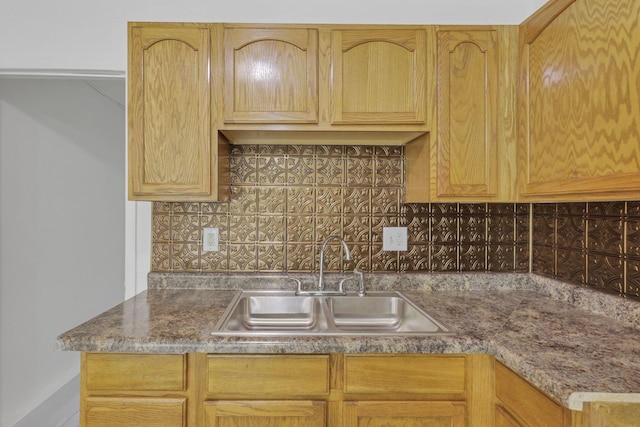 kitchen with tasteful backsplash and sink