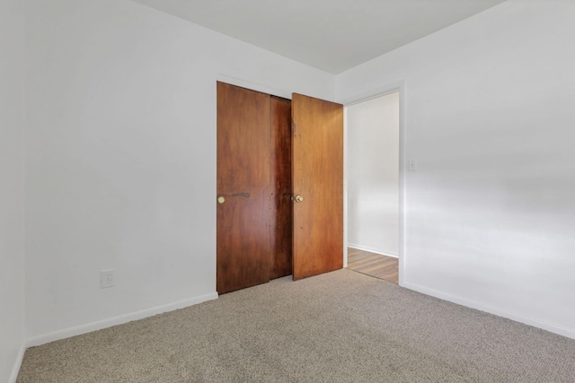 empty room featuring light colored carpet