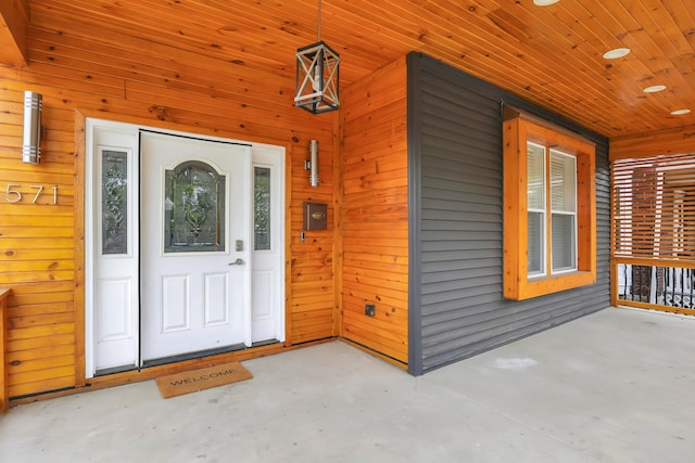 view of exterior entry with a porch