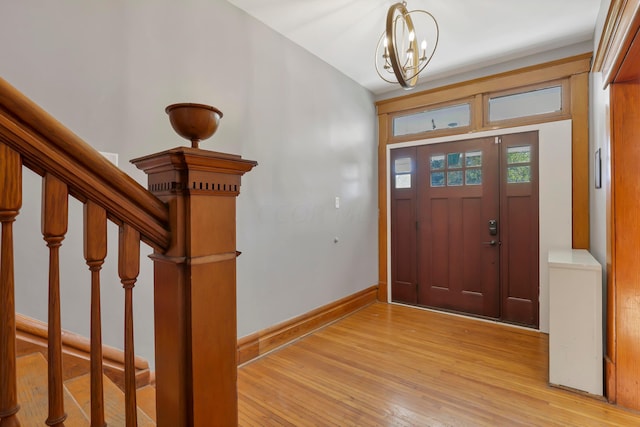 entrance foyer featuring a chandelier and light hardwood / wood-style flooring