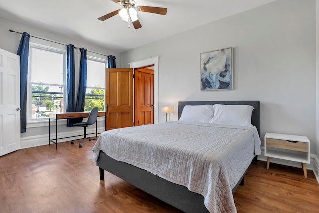 bedroom with ceiling fan and hardwood / wood-style floors