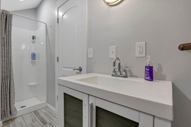 bathroom featuring vanity and walk in shower