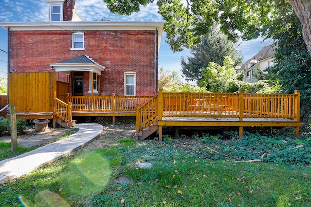 back of house featuring a deck