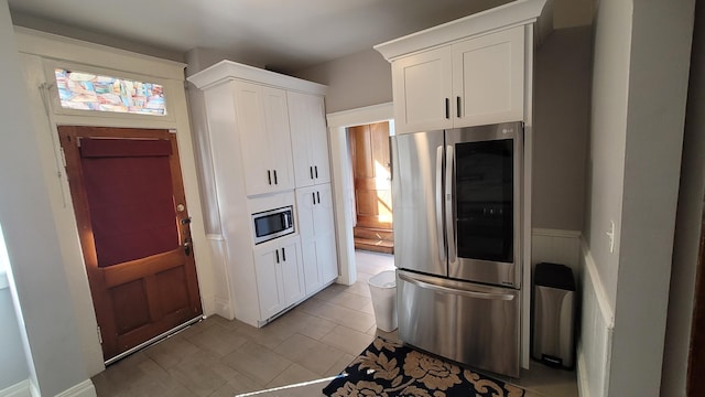 kitchen featuring white cabinetry and stainless steel appliances