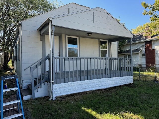 view of front of home featuring a porch and a front lawn