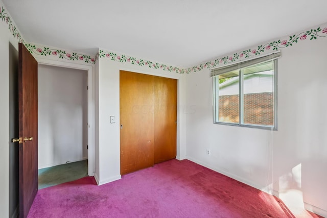 unfurnished bedroom with a closet and carpet