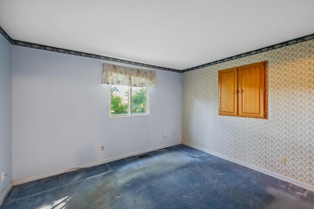 empty room featuring carpet floors