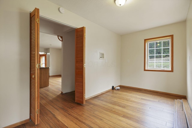 unfurnished room featuring light hardwood / wood-style floors