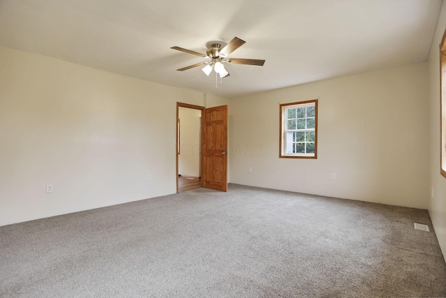 carpeted empty room with ceiling fan