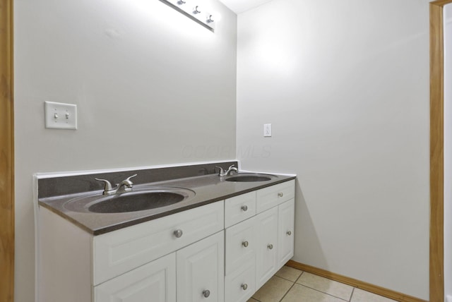 bathroom with tile patterned floors and vanity