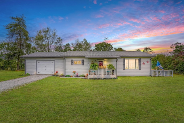 ranch-style home with a lawn and a garage