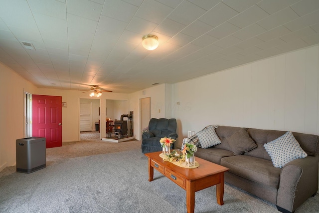 carpeted living room with ceiling fan