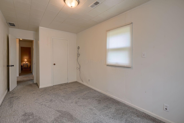 unfurnished bedroom with light colored carpet