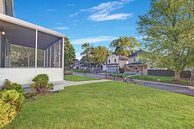 view of yard featuring a sunroom