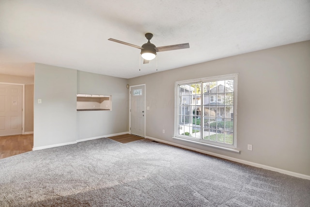 unfurnished room featuring carpet floors and ceiling fan