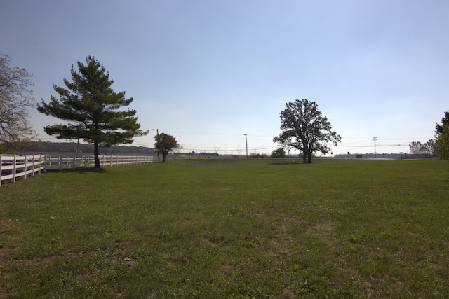 view of yard with a rural view