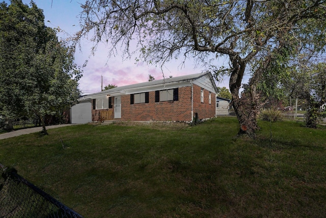 ranch-style house featuring a yard