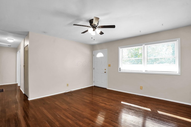 interior space with ceiling fan and dark wood-type flooring