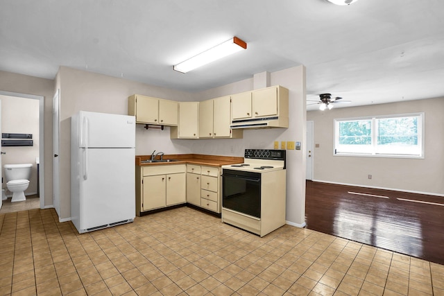 kitchen with white appliances, ceiling fan, sink, cream cabinets, and light hardwood / wood-style flooring