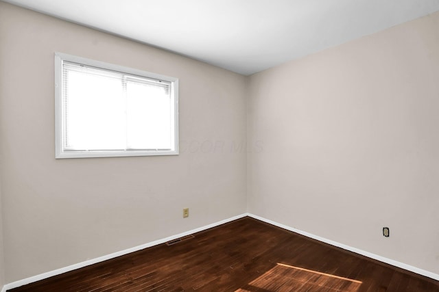 empty room featuring hardwood / wood-style floors