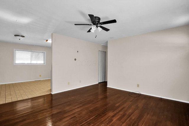 empty room featuring dark hardwood / wood-style floors and ceiling fan