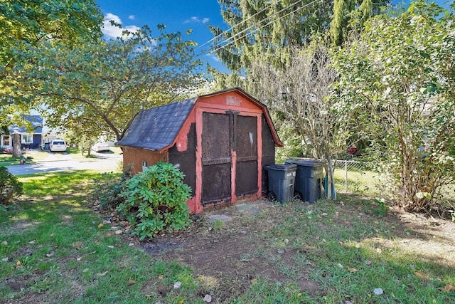 view of outdoor structure featuring a lawn