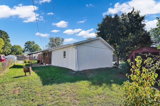 view of property exterior with a yard