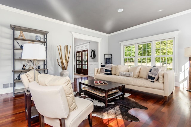 living room featuring ornamental molding and dark wood-type flooring