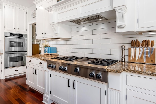 kitchen featuring stone counters, white cabinetry, and appliances with stainless steel finishes