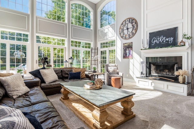 sunroom / solarium with a tile fireplace