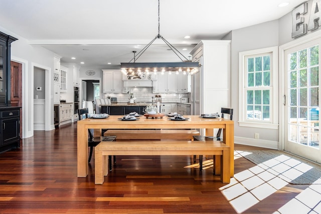 dining area featuring dark wood-type flooring