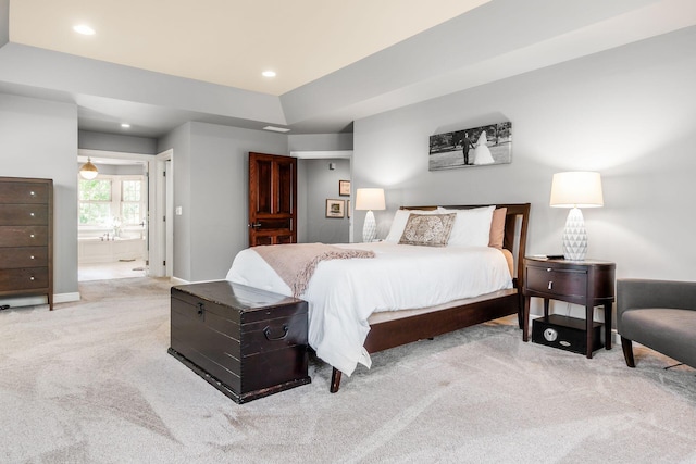 carpeted bedroom featuring connected bathroom