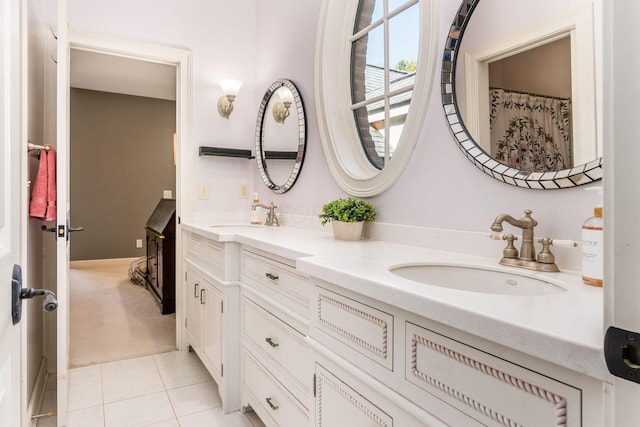 bathroom featuring tile patterned flooring and vanity