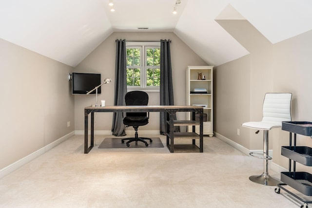 office area with light colored carpet and lofted ceiling