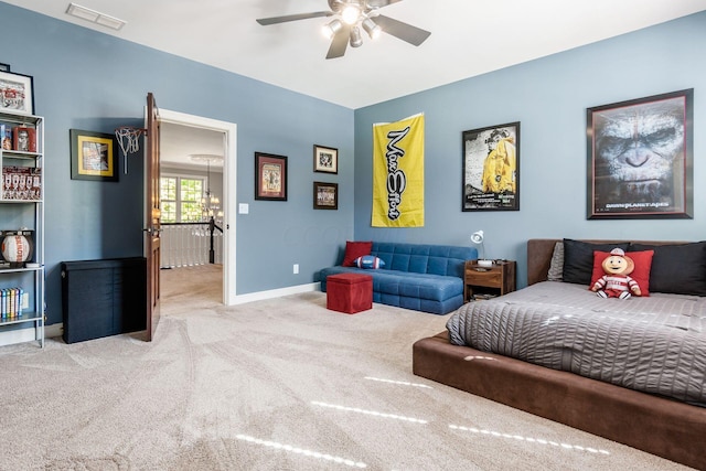 bedroom with ceiling fan and light colored carpet