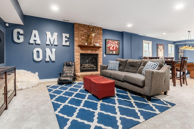 living room featuring carpet floors and a brick fireplace