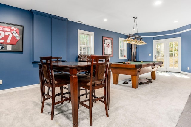 carpeted dining space featuring french doors and pool table