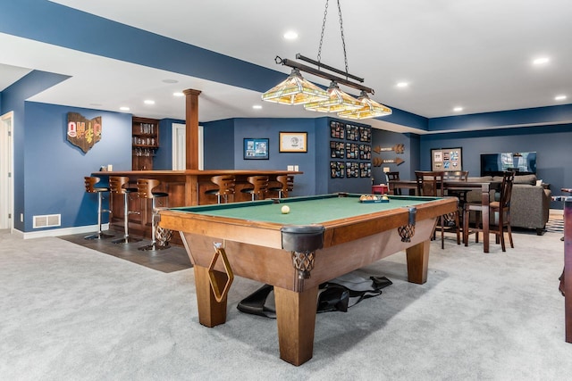 game room featuring decorative columns, carpet floors, pool table, and bar area