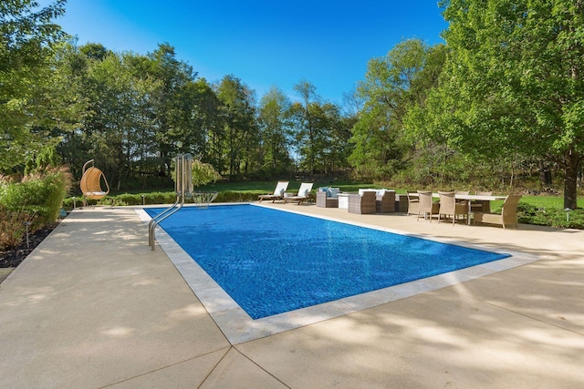 view of pool featuring an outdoor hangout area and a patio