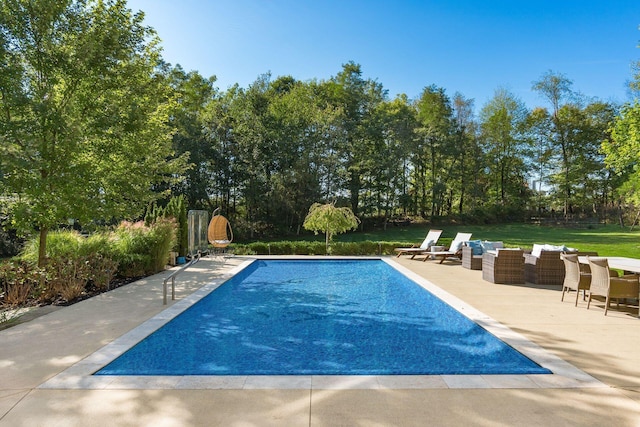 view of pool featuring a patio