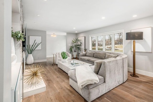 living room with light hardwood / wood-style flooring