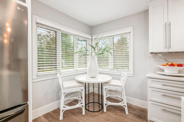 dining room with light hardwood / wood-style flooring