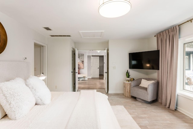 bedroom with light wood-type flooring