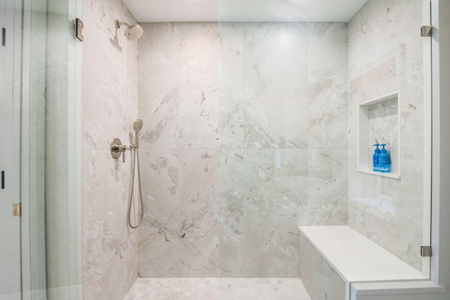 bathroom featuring tiled shower