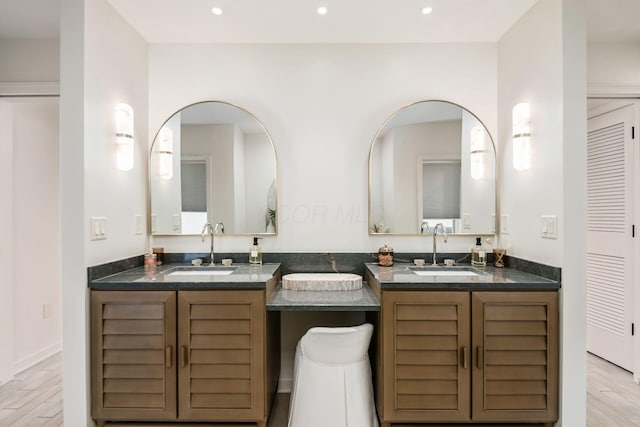 bathroom featuring vanity and hardwood / wood-style flooring