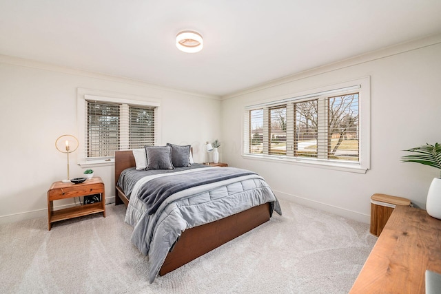 bedroom with light colored carpet and ornamental molding