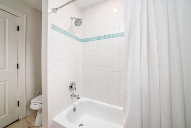 bathroom with shower / tub combo, tile patterned floors, and toilet