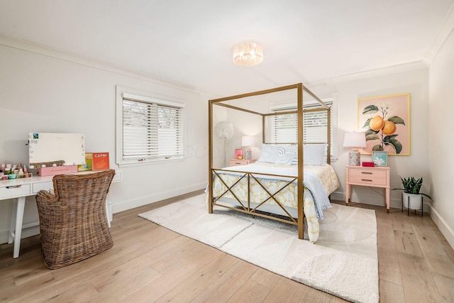 bedroom featuring ornamental molding and light hardwood / wood-style floors